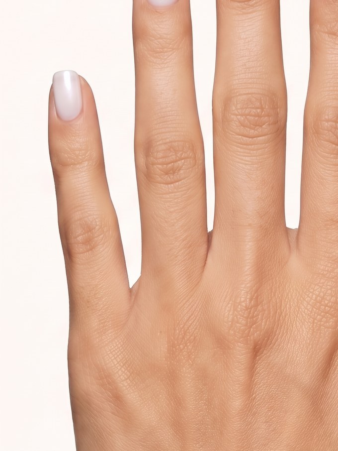 A hand modelling the selected diamond at its true relative size on the ring finger